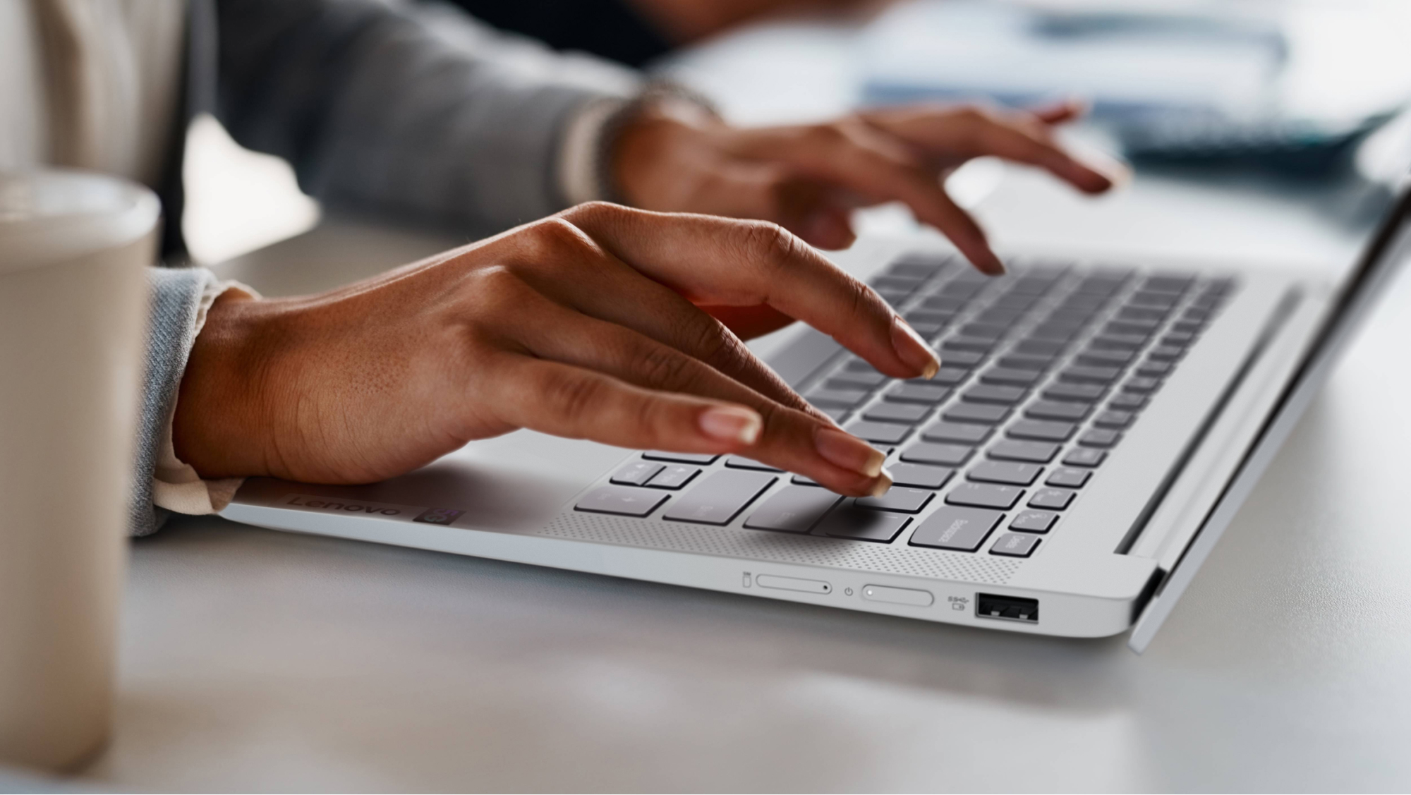 02_Ideapad_5G_Still_Life_Sim_Card_Tray_Home_Office